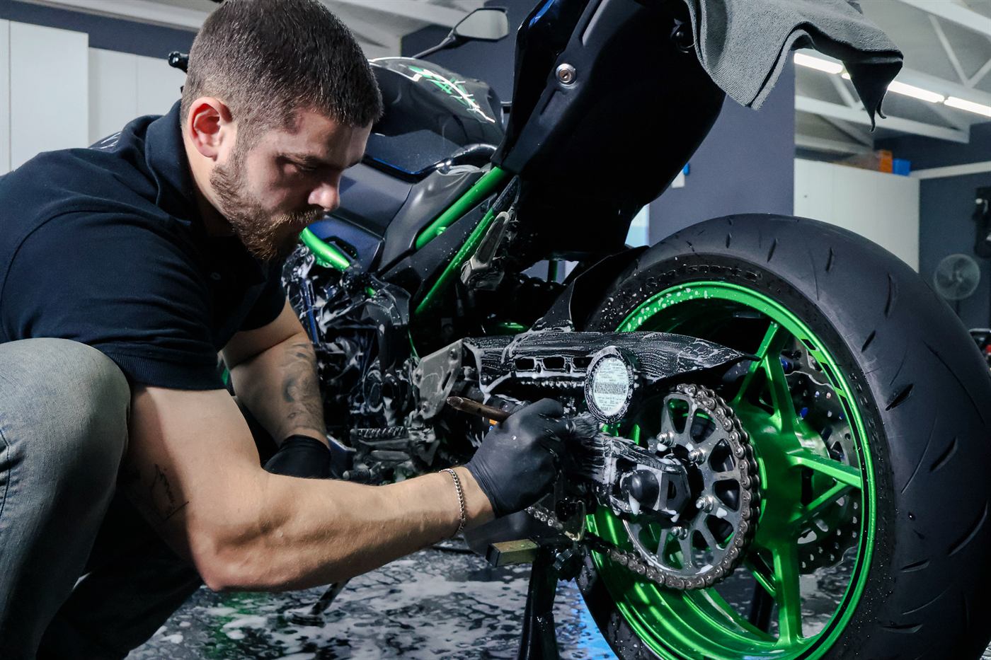 Chain and sprocket being deep cleaned