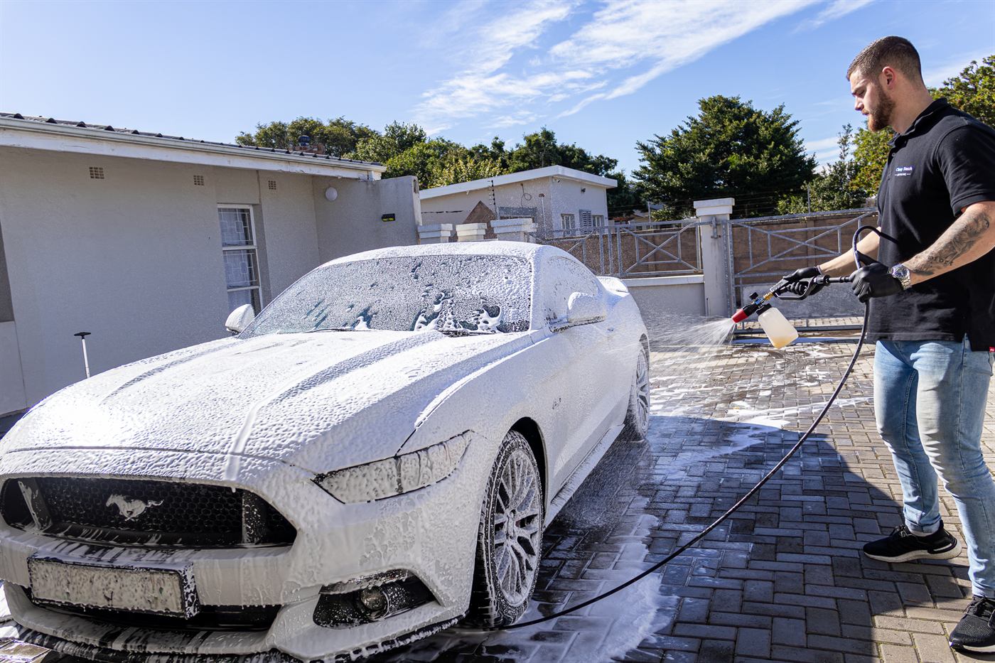 Mustang GT under a full blanket of snow foam